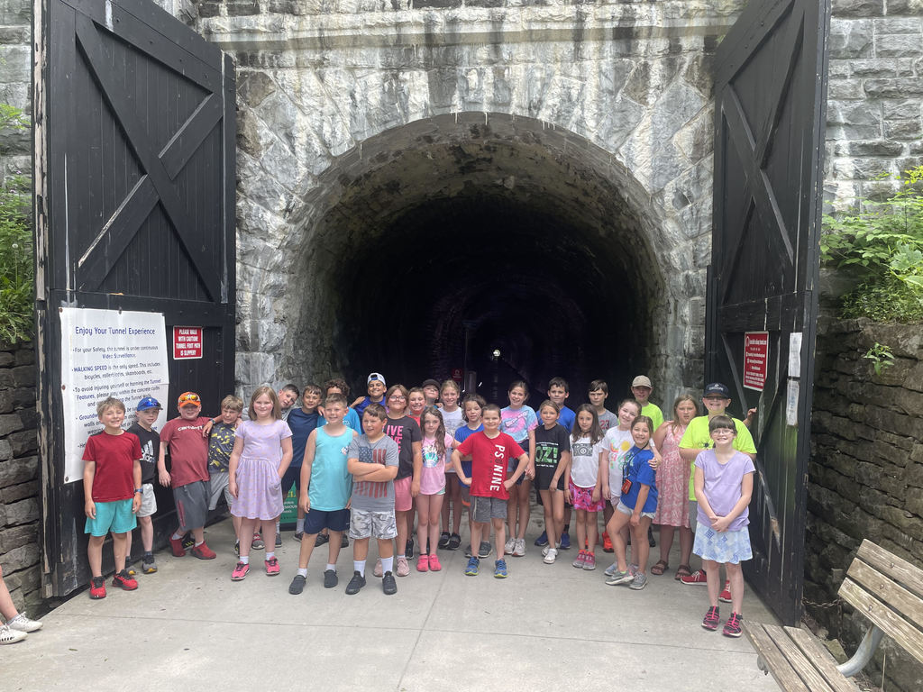 students in front of tunnel